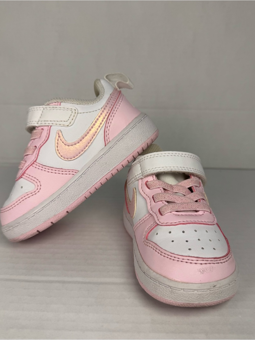 Nike Kids Pink and White Sneakers with Iridescent Swoosh